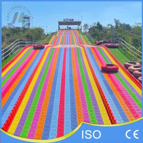 Multi Lane Rainbow Dry Tubing Slide on Hillside
