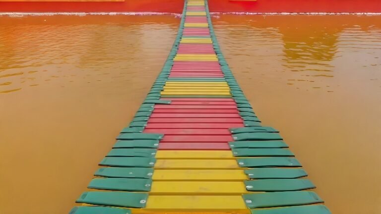 Colorful Suspension Swinging Bridge Over Water With New Padding