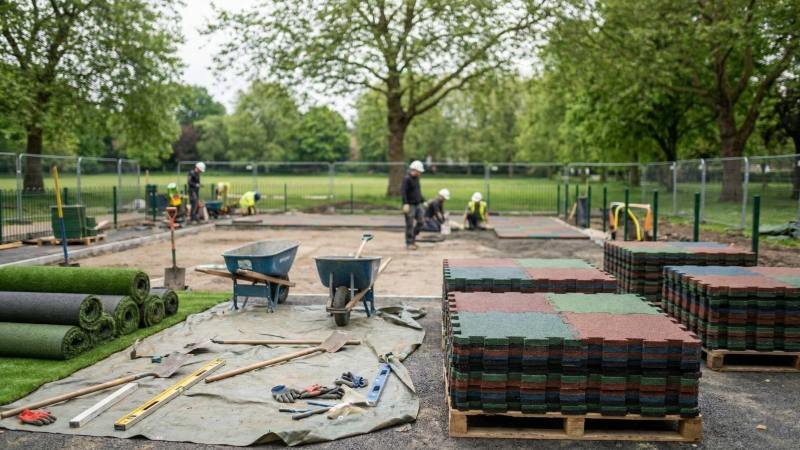 Playground Construction Site With Rolls Of Artificial Turf And Rubber