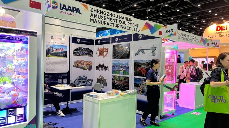 Visitors exploring custom playground designs at Hanlin Amusement exhibition booth in Bangkok