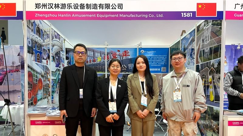 Amusement industry professionals posing at Beijing exhibition