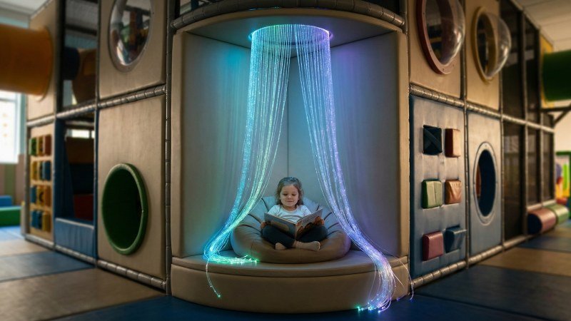 Specialized quiet corner reading pod with calming fiber optic lights