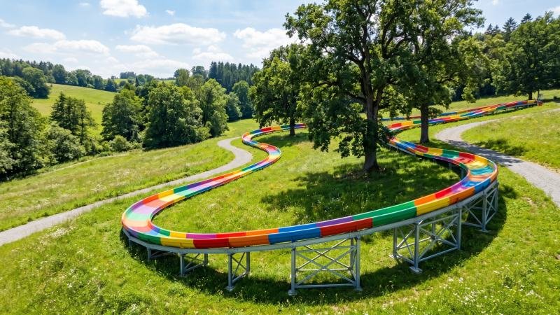 Custom Rainbow Slide Built on Natural Hill Terrain