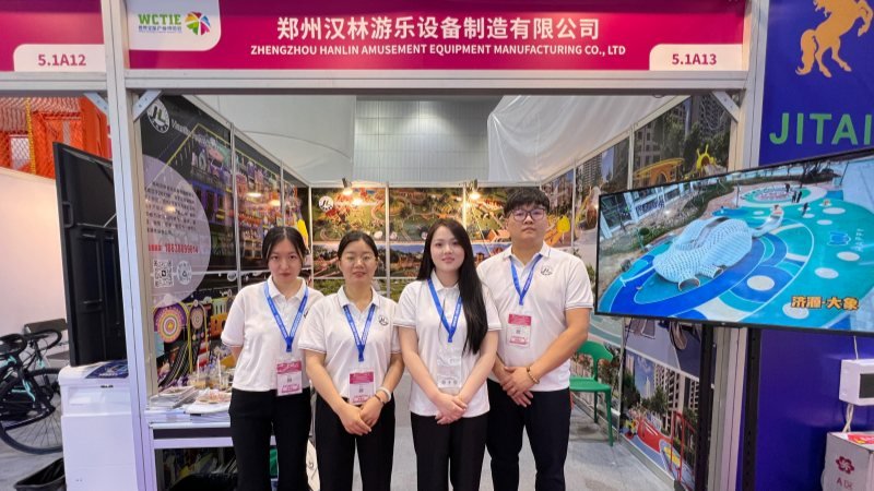 Professional playground equipment manufacturing team at exhibition