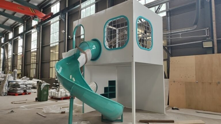 Full View Of Custom White And Teal Indoor Playhouse With Slide